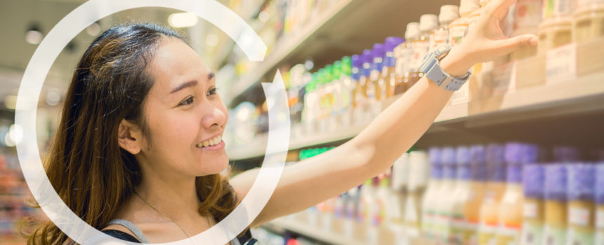 person in store reaching for product with NCS Chevron