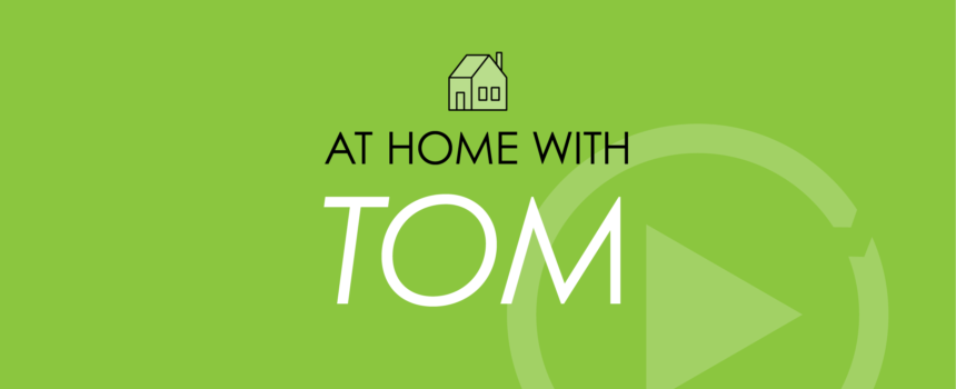 Green background with words At Home With Tom with NCS chevron as well