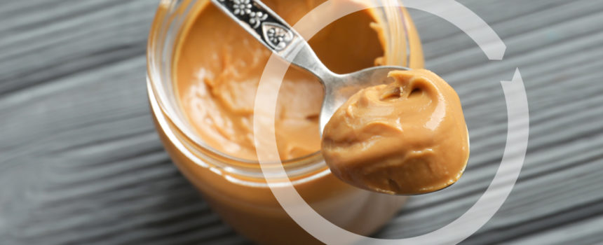 Peanut Butter on a spoon with NCS logo